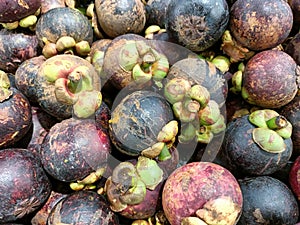 a bunch of mangosteen fruit on display in the supermarket photo