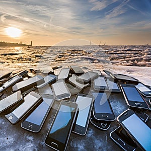 Bunch of mobiles on the seashore evening time photo