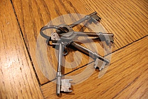 Bunch of mortice lock keys sitting on a wooden table