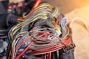 A bunch of multi-colored electrical wires - blue, green, red and yellow, interconnected in the nodes of the car when the network