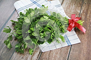 A bunch of natural green parsley with leaves photo