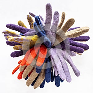 Bunch of new various felted gloves on gray