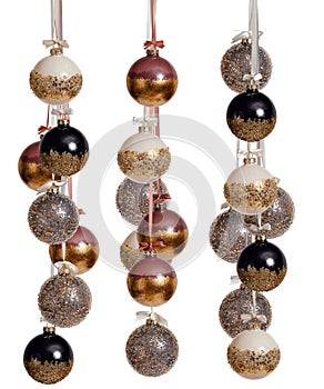 A bunch of New Year's Christmas balls in pink black gold color on a white background.