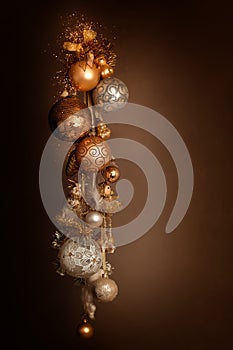 A bunch of New Year\'s Christmas balls of white gold yellow color on a dark background.