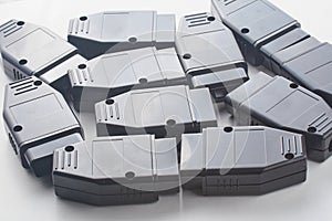 Bunch of OBD2 car scanners and diagnostic interfaces. OBDII professional car scanner. Spare part background texture photo