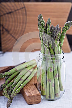 Bunch og fresh green asparagus in a jar