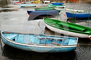 Bunch of old boats in calm water