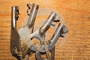 Bunch of old keys  on wooden background