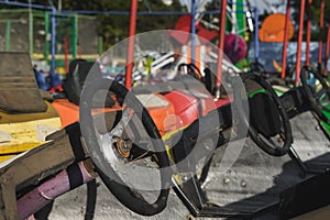 A bunch of old and rusty bumper cars