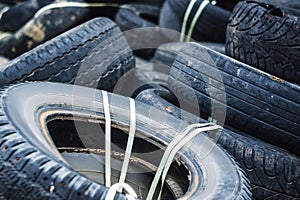 A bunch of old tires from used cars