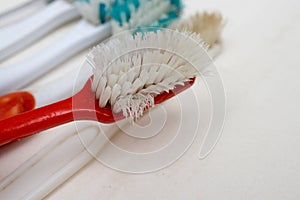 A bunch of old worn out toothbrushes with bent bristles