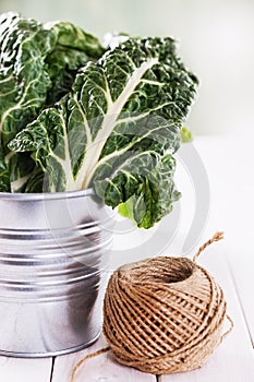 Bunch of organic silverbeet on a metal bucket