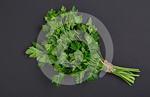 A bunch of parsley bandaged with a rope with a bow