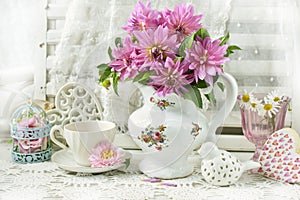 Bunch of pink dahlia in porcelain jug