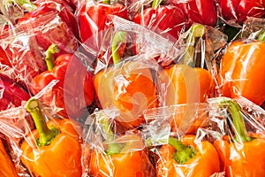 Bunch of plastic wrapped bell peppers
