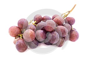 Bunch of purple large grapes on a white background