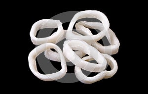 A bunch of raw frozen squid rings isolated on black background