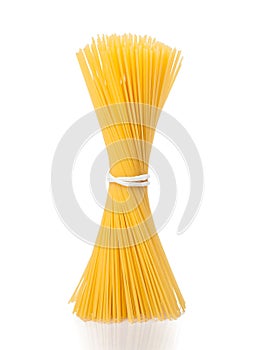 Bunch of raw pasta spaghetti on white background