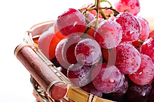Bunch of red grapes in a basket.