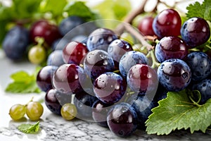 bunch of red grapes with leaves on white floor