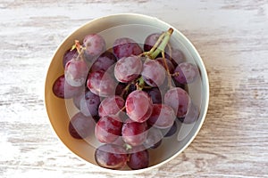 bunch of red grapes on table