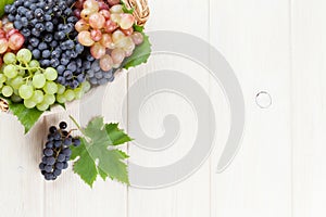 Bunch of red, purple and white grapes in basket