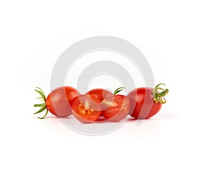 bunch of red ripe cherry tomatoes on a white background