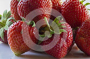 Bunch of red ripe fresh strawberries in a basket