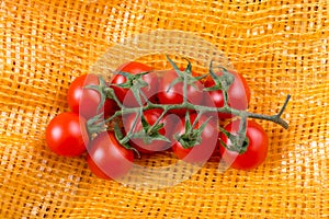 Bunch of red ripe tasty fresh cherry tomatos