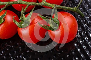 Bunch of red ripe tasty fresh cherry tomatos