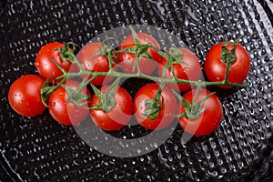 Bunch of red ripe tasty fresh cherry tomatos