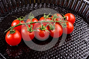 Bunch of red ripe tasty fresh cherry tomatos