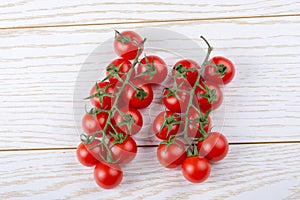 Bunch of red ripe tasty fresh cherry tomatos