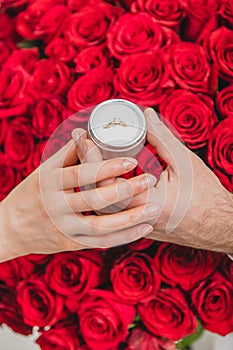 Bunch of red roses, wedding ring and love - all you need for marriage proposal.