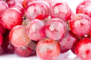 Bunch of red soak grape on white background