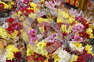 Bouquets of Red, Yellow, and White Flowers for Offering in Temple