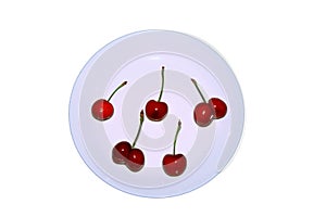 A bunch of ripe cherries on a white plate. Fresh red berries contrast with the