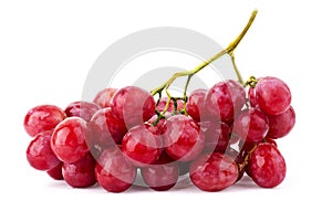 Bunch of ripe red grapes with leaves isolated on white