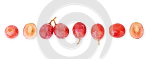 Bunch of ripe red grapes with leaves isolated on white