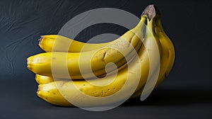 Bunch Of Ripe Yellow Bananas With Minor Blemishes On A Dark Background