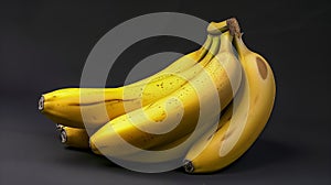 Bunch Of Ripe Yellow Bananas With Minor Blemishes On A Dark Background