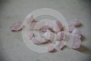 bunch of rosequartz stones on the floor photo