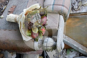 Bunch of rotten fruit and wilted flowers as a symbol of a destroyed old life