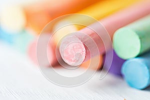 Bunch Row of Multicolored Chalks Crayons on White Background. Education Arts Crafts Creativity Concept.