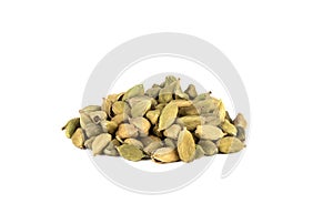 A bunch of seasoning from green cardamom pods on a white background.