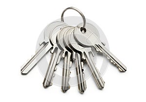 A bunch of silver keys on a ring isolated on white background