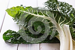 Bunch of silverbeet on a rustic wooden background