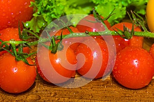 A bunch of small red cherry tomatoes