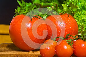 A bunch of small red cherry tomatoes