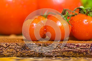 A bunch of small red cherry tomatoes